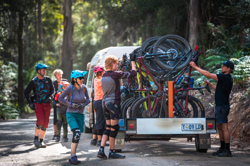 Mountain Bikers unloading a shuttle bus in Blue Derby MTB Trails